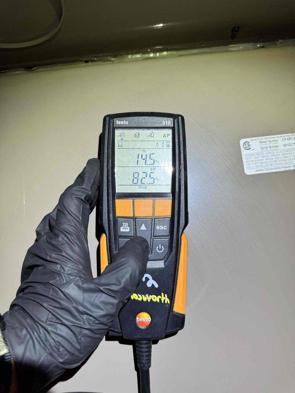 Completed comprehensive heating maintenance on residential HVAC system. Performed diagnostic testing using calibrated digital instruments, recording temperature differential readings of 14.5°F and 82.4°F to verify proper system operation. Conducted thorough inspection of furnace interior components including blower motor assembly, control board, electrical connections, and wiring harnesses. All components found to be functioning within normal parameters with proper electrical connections secured throughout the system.