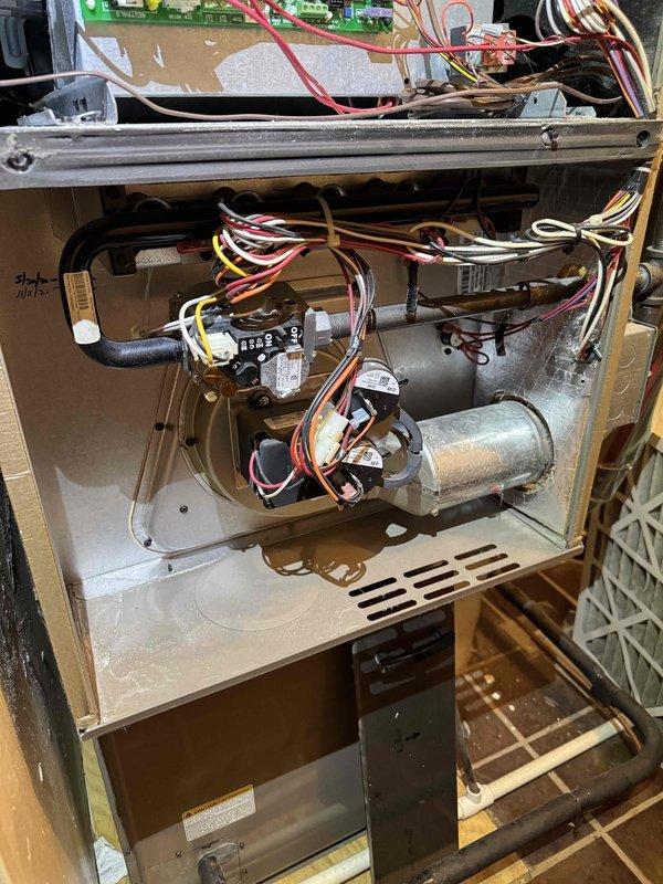 Completed comprehensive heating maintenance on residential HVAC system. Performed diagnostic testing using calibrated digital instruments, recording temperature differential readings of 14.5°F and 82.4°F to verify proper system operation. Conducted thorough inspection of furnace interior components including blower motor assembly, control board, electrical connections, and wiring harnesses. All components found to be functioning within normal parameters with proper electrical connections secured throughout the system.