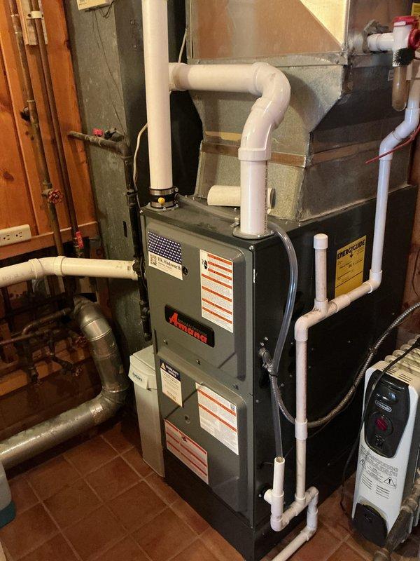 Completed annual heating maintenance visit on Amana furnace system as part of scheduled preventative maintenance program. Performed comprehensive inspection of all internal components including dual motors, electrical connections, control modules, and burner assembly. Verified proper operation of all safety controls, examined color-coded wiring harness for secure connections and signs of wear, and inspected PVC venting system for proper drainage and secure fittings. Cleaned accessible components, checked all mounting hardware for stability, and confirmed furnace is operating within manufacturer specifications for the upcoming heating season.