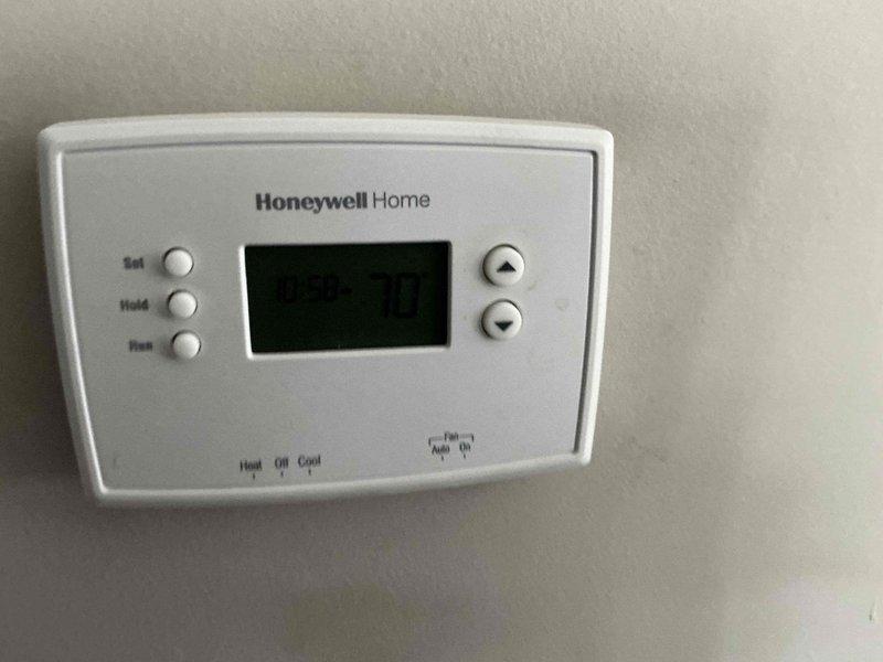 Conducted comprehensive on-site evaluation for complete HVAC system replacement, assessing existing Honeywell Home thermostat and outdoor Lennox heat pump unit. Documented current equipment specifications, energy efficiency ratings, and installation conditions to provide customer with furnace and full system replacement options tailored to their heating and cooling needs.