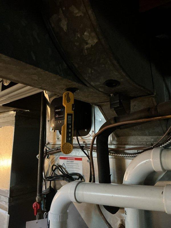 Completed routine cooling season maintenance on residential HVAC system. Performed comprehensive inspection of indoor air handler unit located in crawlspace, including examination of evaporator coil, blower assembly, condensate drain lines, and electrical connections. Verified proper operation of all safety controls and measured system amperage. Inspected outdoor condenser unit, confirmed adequate airflow through coil fins, checked refrigerant lines and electrical disconnect, and verified unit is level on concrete pad with proper clearances maintained. System operating within normal parameters with no deficiencies noted.
