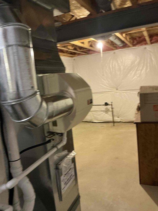 Provided HVAC replacement estimate for outdoor air conditioning unit with multiple access options. Existing furnace is four years old and in good condition, requiring only AC system replacement. Unit location offers easy access for installation, with existing electrical disconnect and refrigerant line routing already in place along exterior wall.