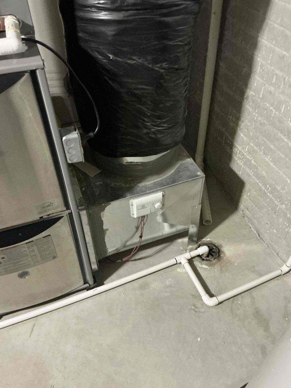 Conducted on-site assessment of existing HVAC system and provided comprehensive replacement estimates including both furnace-only and complete system options. Documented current equipment configuration featuring furnace unit, air handler with blower assembly, and associated condensate drainage system with PVC piping. Reviewed installation parameters and discussed available upgrade pathways to improve heating efficiency and system performance for the residential property.