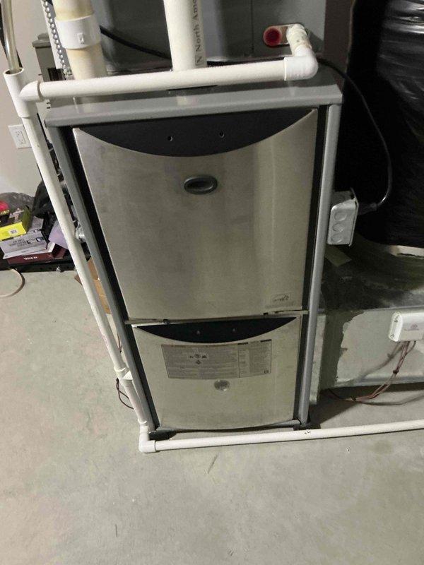 Conducted on-site assessment of existing HVAC system and provided comprehensive replacement estimates including both furnace-only and complete system options. Documented current equipment configuration featuring furnace unit, air handler with blower assembly, and associated condensate drainage system with PVC piping. Reviewed installation parameters and discussed available upgrade pathways to improve heating efficiency and system performance for the residential property.