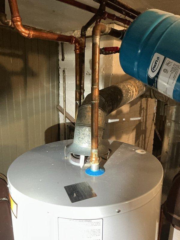 Completed routine maintenance on residential tanked water heater, including full system flush to remove sediment buildup and inspection of all components. Verified proper operation of Honeywell gas control valve, tested temperature and pressure relief valve functionality, and confirmed expansion tank pressure and all copper piping connections were secure with no visible leaks.