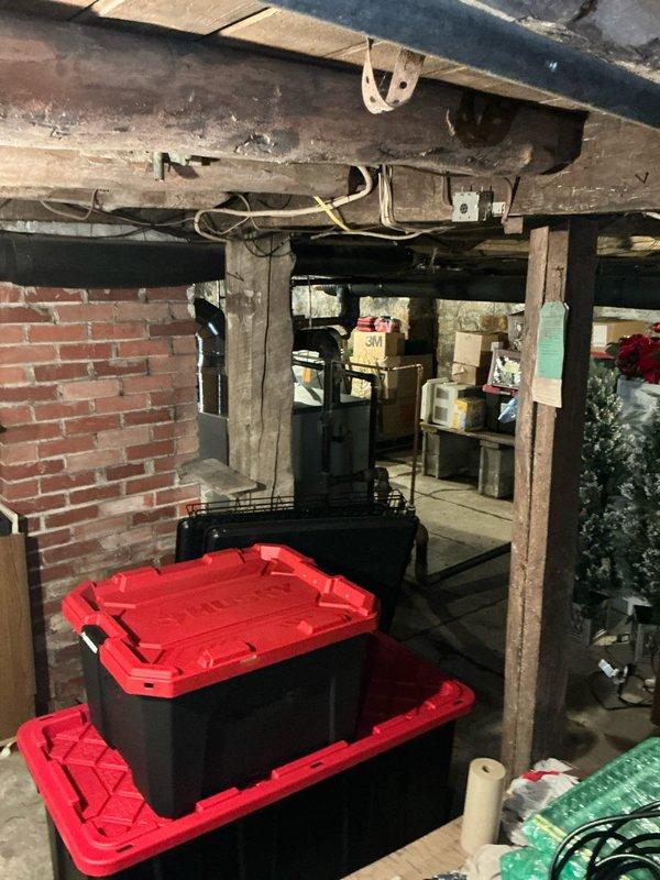 Conducted estimate for residential property with existing steam boiler system to evaluate feasibility of converting to forced air HVAC with air conditioning installation. Inspected basement area containing current boiler equipment and assessed structural framework, available space, and existing utilities for potential ductwork routing. Evaluated attic space and examined insulation conditions, available clearances, and structural capacity for air handler placement and supply/return duct installation. No existing forced air infrastructure present, requiring complete system design and installation from ground up.