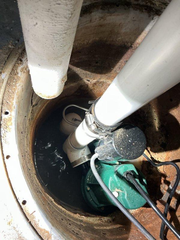 Installed new battery backup sump pump system in basement sump basin to provide reliable water removal and flood protection during power outages. Replaced existing pump assembly with upgraded unit featuring submersible pump, backup power capability, PVC discharge piping, and proper electrical connections to ensure continuous operation and prevent basement flooding.
