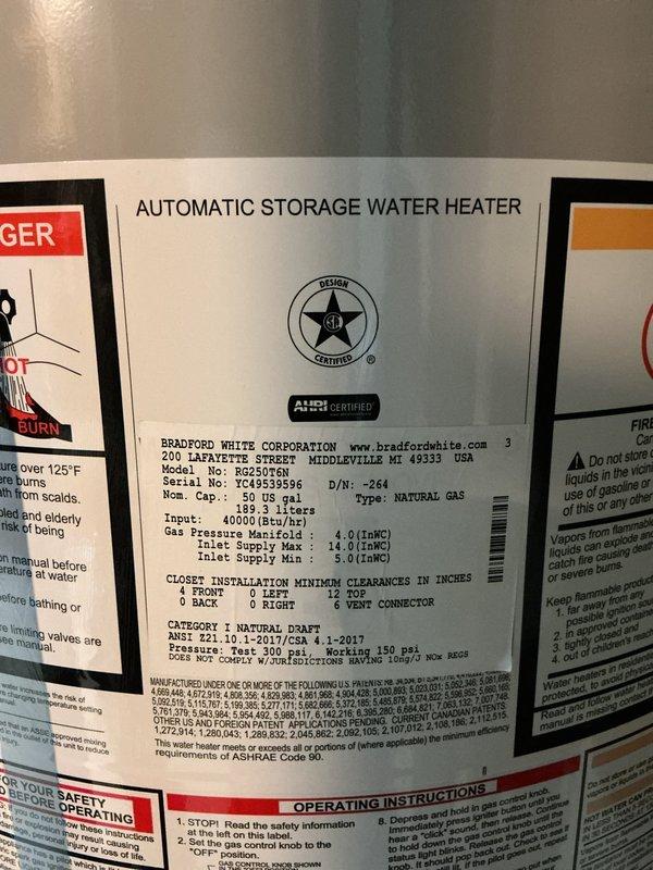 Performed routine maintenance flush on a 50-gallon Bradford White natural gas automatic storage water heater (Model M-1 50T6FBN). Drained sediment buildup from tank bottom to improve heating efficiency and extend unit lifespan. Verified all safety labels and manufacturer specifications remained legible and intact, confirming proper operating parameters of 40,000 BTU/hr input rating and natural draft venting system. Unit operational and returned to service.