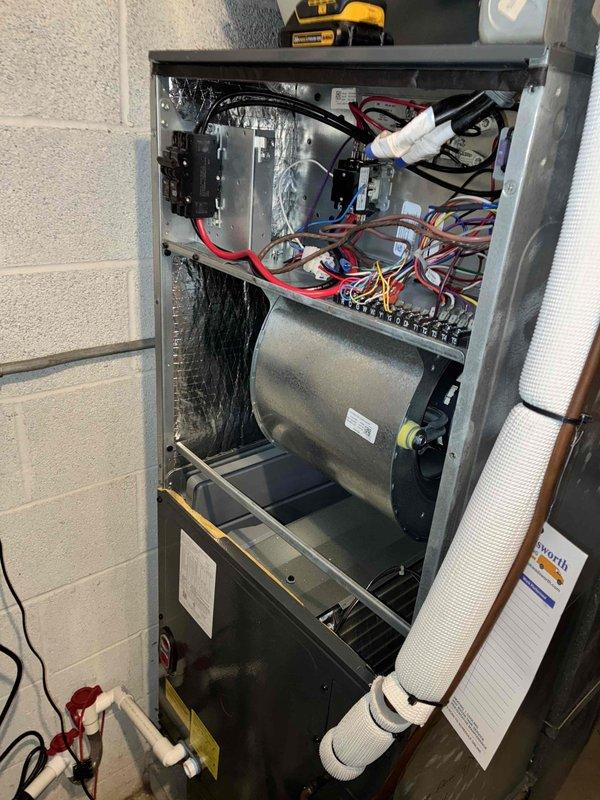 Completed comprehensive heating maintenance on two HVAC systems, performing thorough inspection of all electrical components, contactors, relays, and wiring connections within both air handler units. All blower motor assemblies, control panels, circuit breakers, and safety devices were examined and found to be operating within normal parameters, with documentation photos captured for service records.
