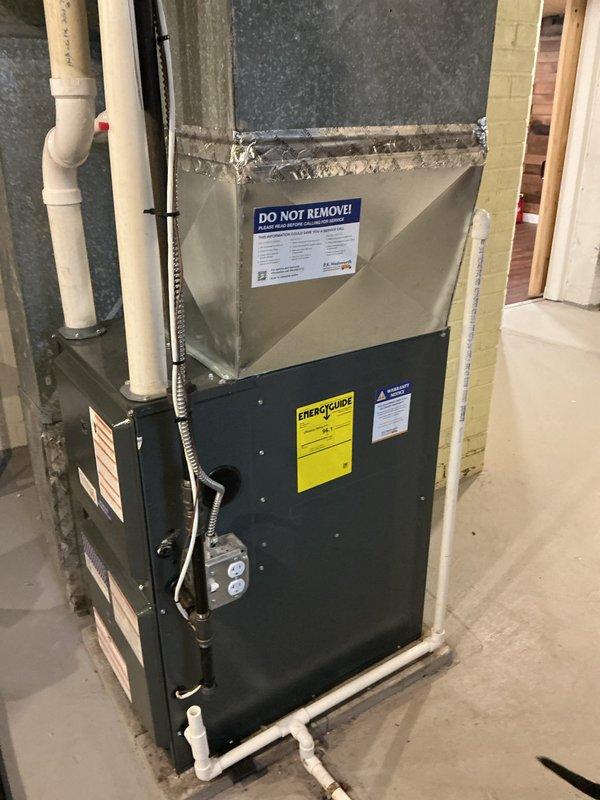 Completed comprehensive heating maintenance on residential HVAC furnace system located in basement utility area. Performed standard seasonal inspection including filter check, burner examination, heat exchanger inspection, blower motor assessment, and verification of proper venting through PVC exhaust and intake pipes. System tested and confirmed operational with all safety controls functioning within manufacturer specifications.