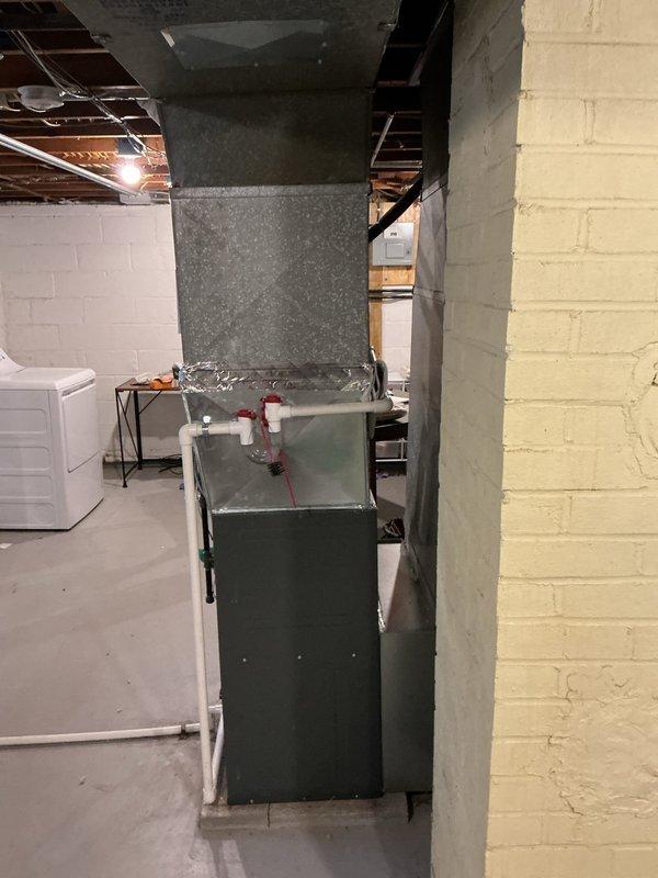Completed comprehensive heating maintenance on residential HVAC furnace system located in basement utility area. Performed standard seasonal inspection including filter check, burner examination, heat exchanger inspection, blower motor assessment, and verification of proper venting through PVC exhaust and intake pipes. System tested and confirmed operational with all safety controls functioning within manufacturer specifications.