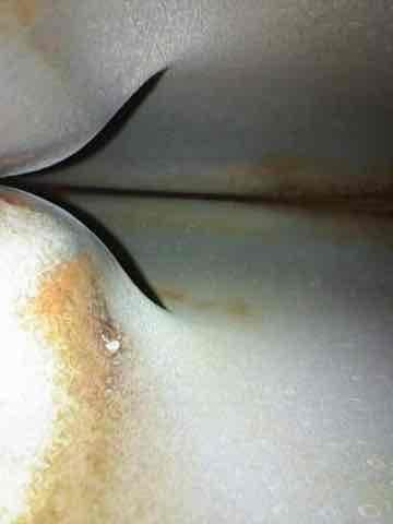 Completed comprehensive heating system maintenance on unit over 10 years old. Inspected ductwork in crawl space area, noting visible rust staining and oxidation on metal supply ducts indicating age and moisture exposure typical of older HVAC installations. Performed standard maintenance protocol including system inspection, filter check, and operational verification to ensure proper heating function for continued reliable operation.