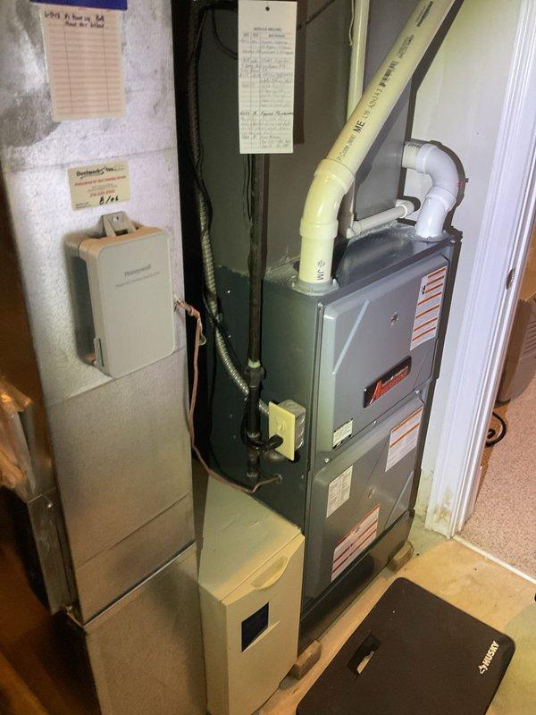 Responded to no heat call on residential gas furnace system. Upon arrival, performed diagnostic inspection of furnace unit with red louvered front panel. Assessed internal components including blower motor assembly, control board, and electrical connections. Inspected wiring harnesses, safety controls, and ignition system. Verified proper operation of all mechanical and electrical components. System restored to full operational status with heat functioning properly.