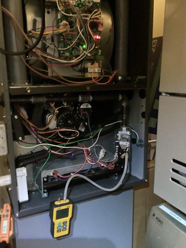 Completed comprehensive heating system maintenance on furnace unit. Performed thorough inspection of all internal components including heat exchanger, burner assembly, blower motor, and control board. Verified proper operation of electronic controls with illuminated status indicators confirming system functionality. Inspected all electrical connections and wiring throughout the cabinet, checked blower motor shaft and bearings for proper operation, and conducted diagnostic testing using digital meter to verify system performance parameters. All components found to be operating within manufacturer specifications. Unit tested and left in proper working condition.