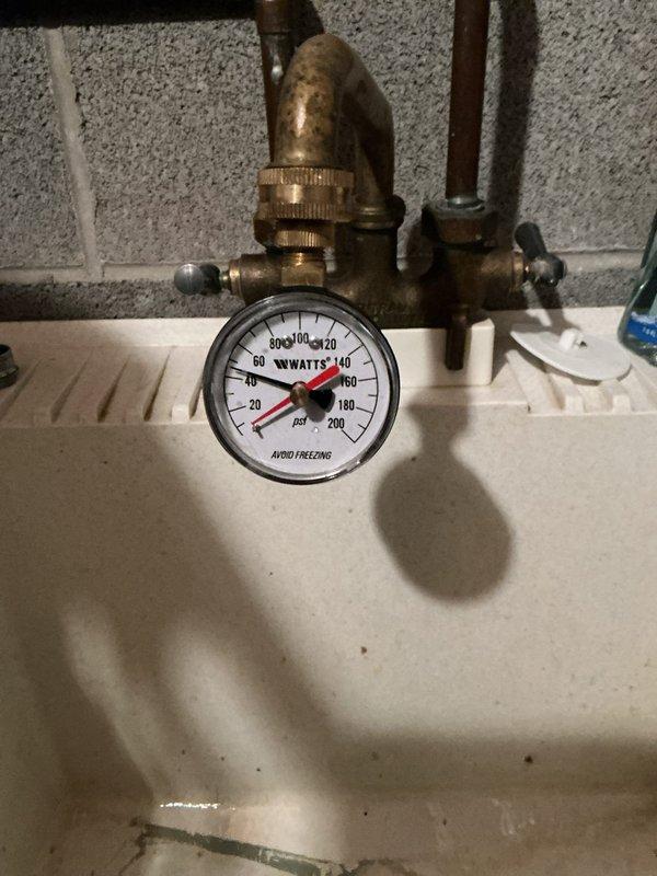 Performed routine maintenance on tanked water heater system, including comprehensive inspection of all critical components. Verified proper operation of temperature and pressure relief valve, confirmed pressure gauge readings within normal parameters (0-200 PSI range), and inspected all brass fittings and connections for signs of corrosion or leakage. Examined burner assembly and combustion chamber, confirming proper ignition system function with clean blue flame pattern indicating efficient fuel combustion. All electrical connections, wiring, and control components inspected and found in good working order.