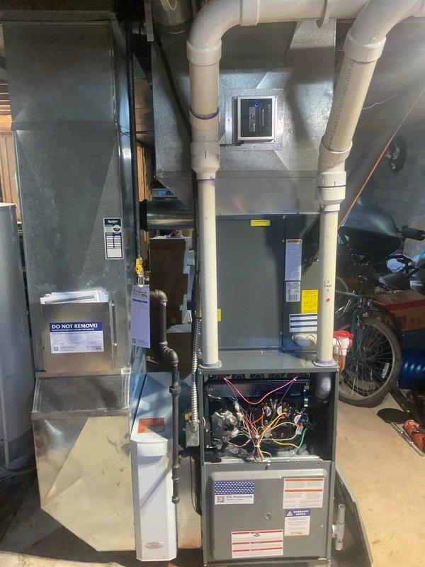 Completed comprehensive heating system maintenance on residential furnace unit under MVP maintenance program. Performed thorough inspection of all mechanical and electrical components including motor assembly, gas valve mechanism, brass fittings, and control boards. Verified proper operation of blower assembly, checked all electrical connections and wiring bundles for secure termination, and confirmed PVC condensate drainage system is functioning correctly. All components found to be operating within manufacturer specifications with no issues identified.