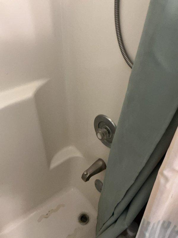 Conducted comprehensive plumbing inspection of residential bathroom fixtures including sink vanity with chrome faucet assembly and bathtub installation with shower diverter system. Documented condition of all visible plumbing components, drain assemblies, and water supply fixtures with photographic evidence for maintenance records.