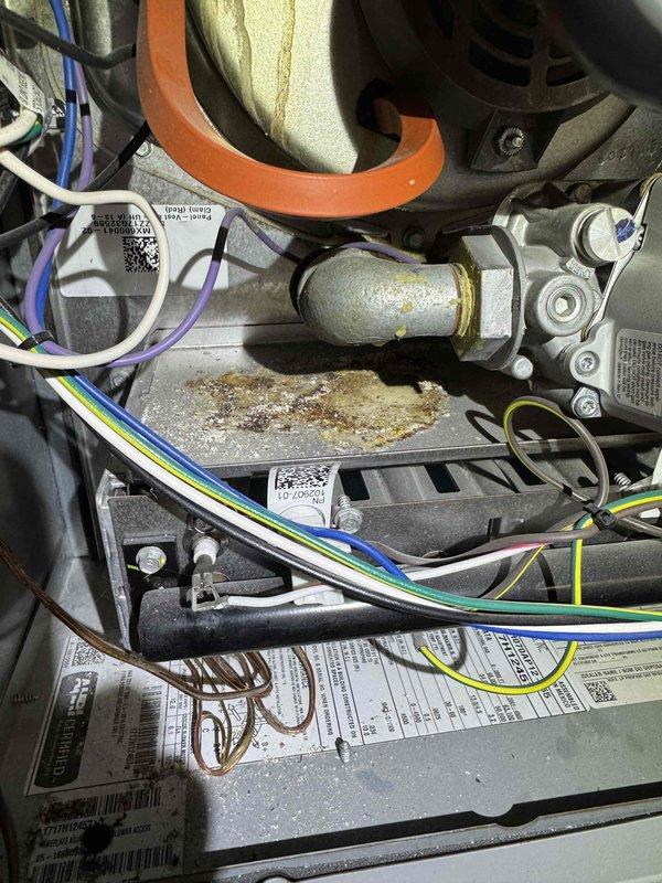Responded to follow-up service call for HVAC system unable to switch from heating to cooling mode after recent thermostat replacement. Performed diagnostic inspection of furnace and control systems, examining internal wiring connections, thermostat communication with equipment, and reversing valve operation. Inspected blower motor assembly, gas valve connections, and electrical components to verify proper system integration. Documented existing equipment condition including corrosion on heat exchanger platform and overall system wear patterns typical of aging unit.