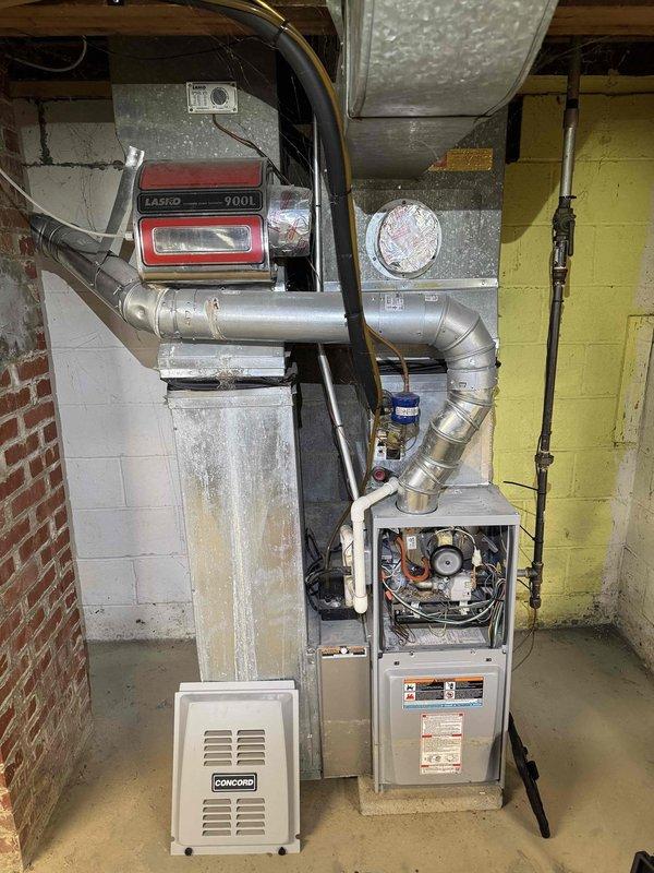 Responded to follow-up service call for HVAC system unable to switch from heating to cooling mode after recent thermostat replacement. Performed diagnostic inspection of furnace and control systems, examining internal wiring connections, thermostat communication with equipment, and reversing valve operation. Inspected blower motor assembly, gas valve connections, and electrical components to verify proper system integration. Documented existing equipment condition including corrosion on heat exchanger platform and overall system wear patterns typical of aging unit.