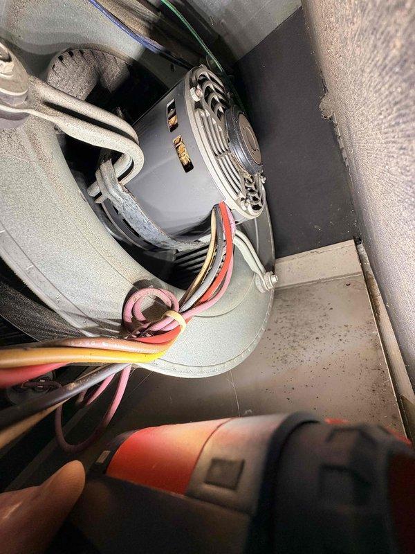 Performed comprehensive new homeowner system evaluation of HVAC equipment installed in confined utility space. Inspected blower motor assembly, electrical connections, ductwork integrity, and associated plumbing components including copper piping and valve assemblies. All equipment photographed and documented, with system confirmed operational and ready for homeowner occupancy.