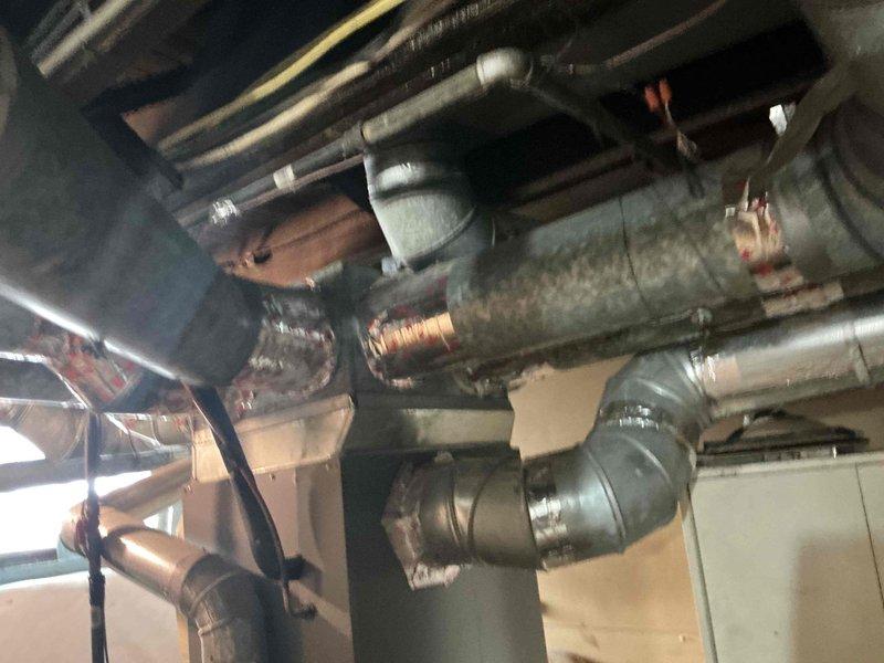 Conducted on-site evaluation of 18-year-old furnace system showing signs of failure. Assessed existing HVAC ductwork, piping infrastructure, and mechanical systems in basement utility area to provide replacement options and recommendations for new equipment installation.