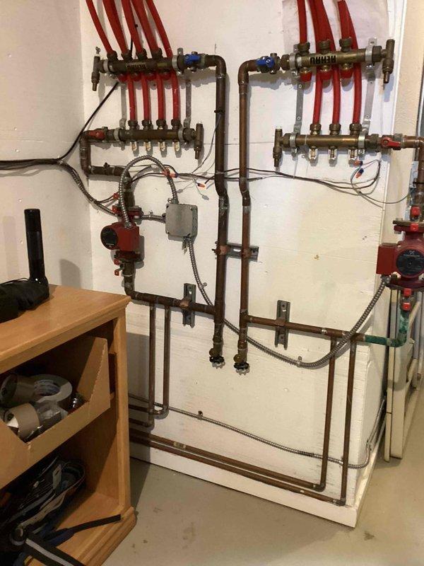Completed comprehensive boiler maintenance on hydronic radiant heating system. Performed full inspection of dual-zone manifold assembly with PEX distribution lines, circulator pump operation, control relays, and associated copper piping network. All components including ball valves, expansion tank, and electrical connections verified operational and system confirmed functioning properly.