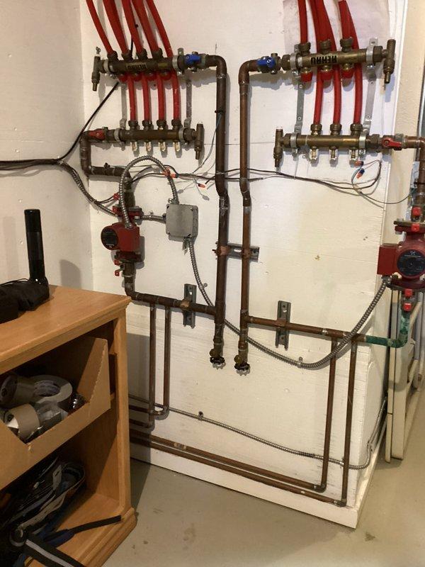 Completed comprehensive boiler maintenance on hydronic radiant heating system. Performed full inspection of dual-zone manifold assembly with PEX distribution lines, circulator pump operation, control relays, and associated copper piping network. All components including ball valves, expansion tank, and electrical connections verified operational and system confirmed functioning properly.