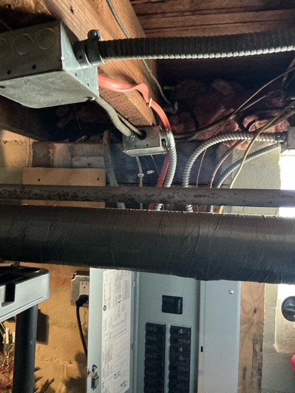 Performed comprehensive evaluation of existing boiler system and associated piping infrastructure dating from the 1970's era. Assessed aged copper distribution piping showing significant oxidation and patina, finned heat exchanger components, and overall system configuration within basement mechanical space. Documented current conditions of HVAC ductwork, electrical panel integration, and plumbing connections to provide multiple replacement options for outdated heating system and deteriorated piping network.