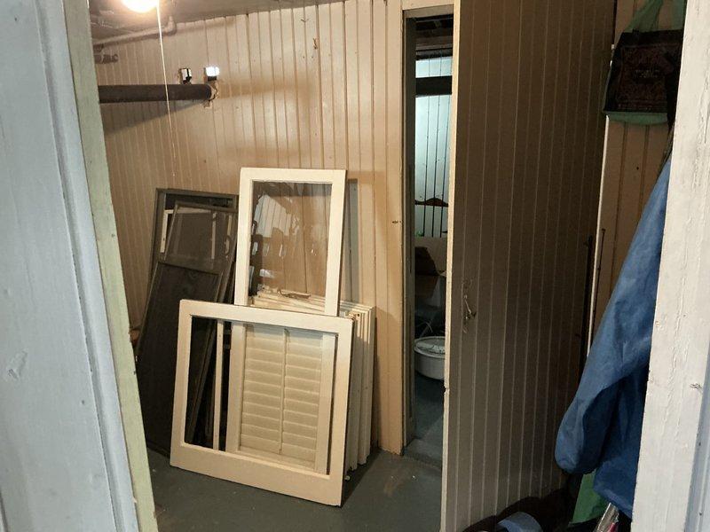 Conducted on-site evaluation for mini split system installation options in residential property with existing boiler heating system. Assessed basement utility area and adjacent room with wood paneling to determine optimal equipment placement and review space constraints for proposed ductless mini split configuration.