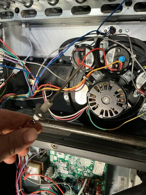 Completed scheduled heating maintenance on residential furnace system as part of ongoing preventative maintenance program. Performed comprehensive inspection of dual blower motor assembly, verified all electrical connections and wire harnesses for proper termination and security, and examined control board functionality. All components including motors, circuit board, condensate drainage system, and PVC venting found to be operating within normal parameters with no deficiencies noted.