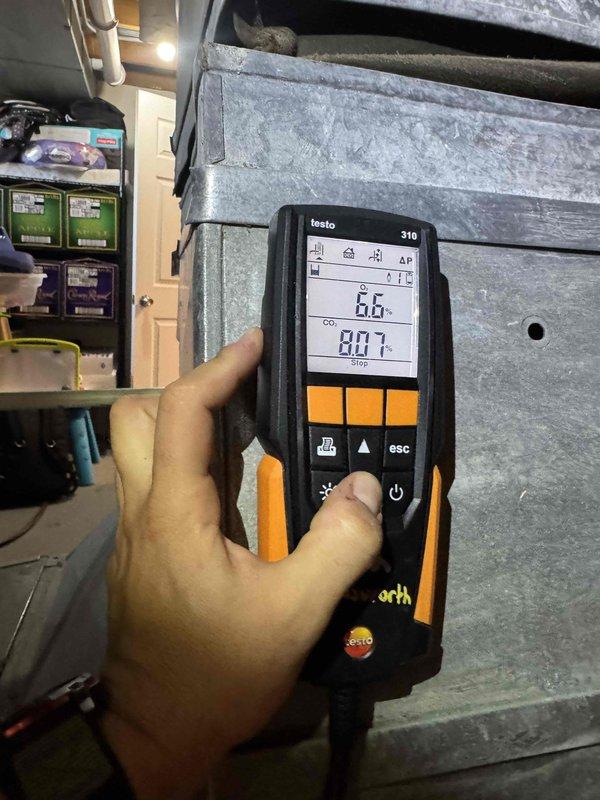 Completed first-year heating maintenance on two HVAC systems, performing combustion analysis and system diagnostics. Investigated reported loud buzzing noise from air conditioning unit that occurred during attempted weekend startup; documented equipment age and humidifier installation for service records.