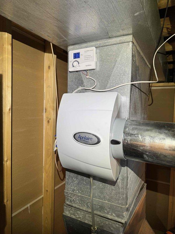 Completed first-year heating maintenance on two HVAC systems, performing combustion analysis and system diagnostics. Investigated reported loud buzzing noise from air conditioning unit that occurred during attempted weekend startup; documented equipment age and humidifier installation for service records.