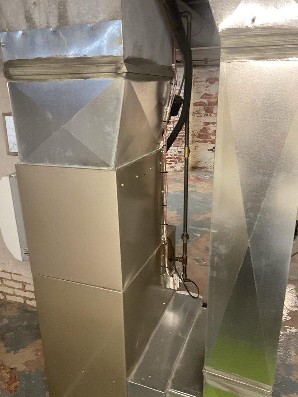 Completed comprehensive heating system maintenance on residential HVAC unit with integrated Aprilaire humidifier in basement utility area. Performed standard inspection of furnace components, ductwork transitions, refrigerant lines, and associated plumbing connections including water supply valve for humidification system. All equipment found operating within normal parameters with no immediate repairs required.