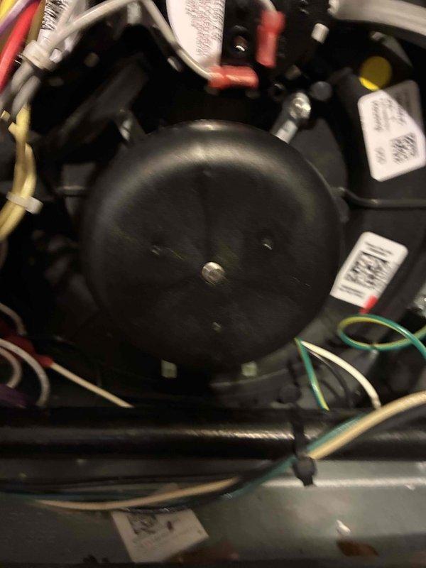 # HVAC Maintenance Completed

Performed annual preventative maintenance on residential forced-air furnace system as part of scheduled service plan. Conducted comprehensive inspection of air handler unit, including examination of evaporator coil with diamond-pattern mesh filter showing moderate dust accumulation consistent with normal operation. Inspected blower motor assembly, electrical connections, and control components. Verified proper wire routing and secure termination of all electrical connections including red, yellow, white, black, and green conductors. Examined compressor motor mounting and hardware for stability and proper operation. All system components found to be functioning within normal parameters with no immediate repairs required.