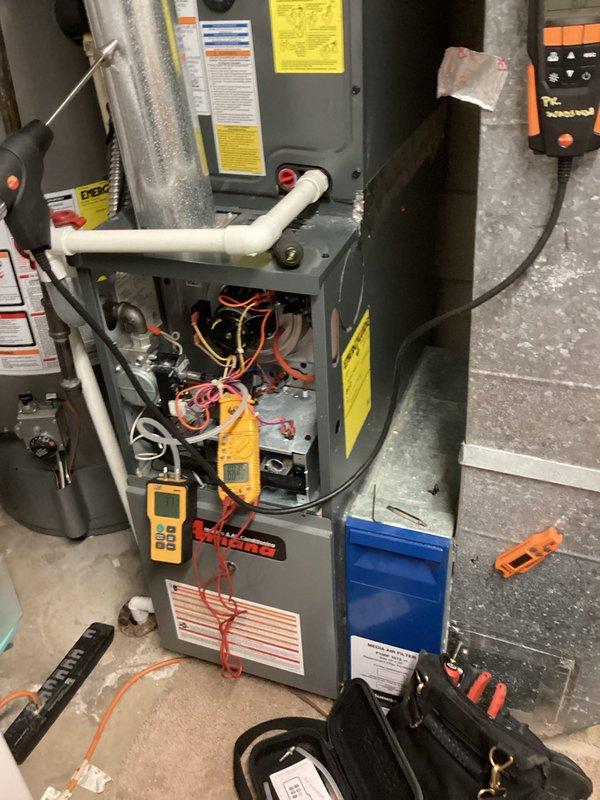 Performed comprehensive heating maintenance on residential furnace system. Conducted electrical diagnostics using digital multimeter to verify proper voltage and amperage readings across control board and safety circuits. Inspected all internal components with access panel removed, tested blower motor operation, and verified proper function of all electrical connections and control sequences. System operating within manufacturer specifications upon completion of maintenance procedures.