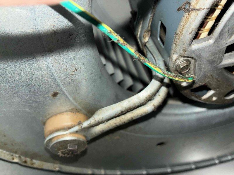 Completed scheduled heating maintenance on furnace system as part of ongoing service plan. Performed system diagnostics using calibrated digital manometer, recording pressure readings of 12.5 and 474 to verify proper airflow and system operation. Inspected blower motor assembly, electrical connections, and ductwork components. Noted normal operational wear including dust accumulation on blower motor housing and minor surface corrosion on wire retention brackets, though all wiring remained intact and properly secured with ground wire correctly installed. All system components found to be functioning within acceptable parameters with no immediate repairs required.