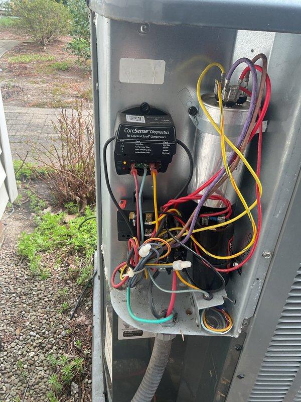 # HVAC Cooling Maintenance Summary

Completed scheduled preventive maintenance on outdoor AC unit. Performed comprehensive system diagnostics using CoreSense compressor monitoring equipment and Fieldpiece SMAN digital manifold gauges to assess refrigerant pressures, superheat, and subcool temperatures, confirming all operating parameters within manufacturer specifications.

# Detailed Work Performed

Conducted thorough cooling season maintenance on residential air conditioning system. Accessed outdoor condensing unit and removed service panel to inspect internal electrical components and connections. All wiring, including power conductors and control circuits, appeared in good condition with no signs of overheating, corrosion, or loose connections.

Installed CoreSense diagnostic equipment to monitor compressor performance and electrical characteristics during system operation. This advanced diagnostic tool provides real-time analysis of compressor health and system efficiency.

Connec
