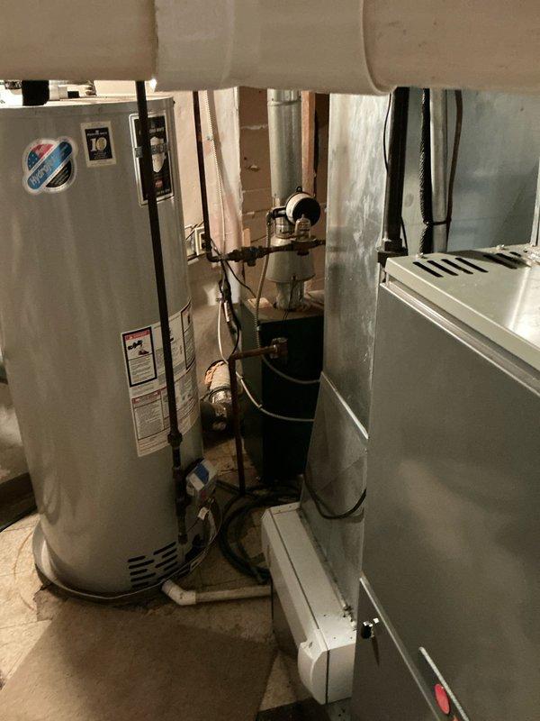 Performed on-site assessment for boiler replacement on existing GWA 052N-S unit experiencing chronic pilot assembly corrosion. Inspected current hydronic heating system including Amtrol Extrol expansion tank, copper distribution piping, and associated mechanical components. Documented existing equipment configuration and provided replacement options to address ongoing pilot metal lead rust failure affecting system reliability.