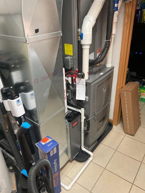 Completed scheduled heating maintenance on residential gas furnace system. Performed comprehensive inspection of all internal components including heat exchanger, blower motor assembly, gas valve manifold with distribution connections, pressure switches, and safety controls. Verified proper operation of ignition system, flame sensor, and all electrical connections throughout the unit. Inspected condensate drainage system including PVC piping, valves, and discharge lines for proper flow and secure connections. All components found operating within manufacturer specifications with no issues identified.