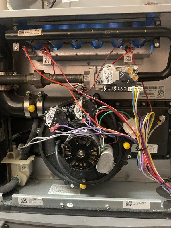 Completed scheduled heating maintenance on residential gas furnace system. Performed comprehensive inspection of all internal components including heat exchanger, blower motor assembly, gas valve manifold with distribution connections, pressure switches, and safety controls. Verified proper operation of ignition system, flame sensor, and all electrical connections throughout the unit. Inspected condensate drainage system including PVC piping, valves, and discharge lines for proper flow and secure connections. All components found operating within manufacturer specifications with no issues identified.