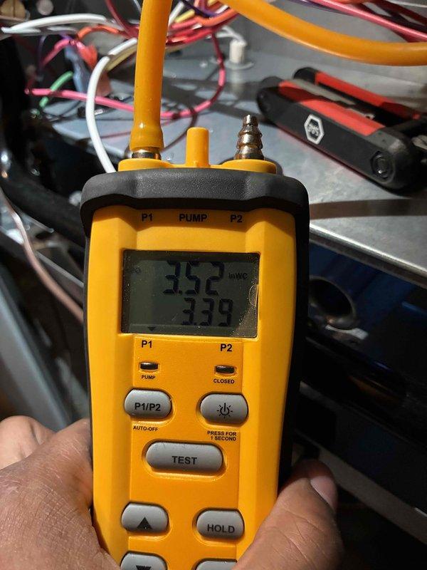 Completed furnace and humidifier installation with system commissioning. Performed refrigerant pressure diagnostics using digital manifold gauge set, recording readings of 352 and 338 PSI to verify proper system charge and operation. Installed gas shut-off valve on copper supply line with secure mounting and proper connections to ductwork plenum, ensuring all piping, wiring, and flexible conduit were properly secured with cable ties and met code requirements.