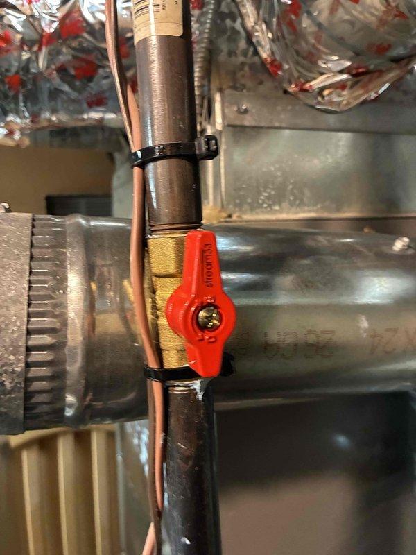 Completed furnace and humidifier installation with system commissioning. Performed refrigerant pressure diagnostics using digital manifold gauge set, recording readings of 352 and 338 PSI to verify proper system charge and operation. Installed gas shut-off valve on copper supply line with secure mounting and proper connections to ductwork plenum, ensuring all piping, wiring, and flexible conduit were properly secured with cable ties and met code requirements.