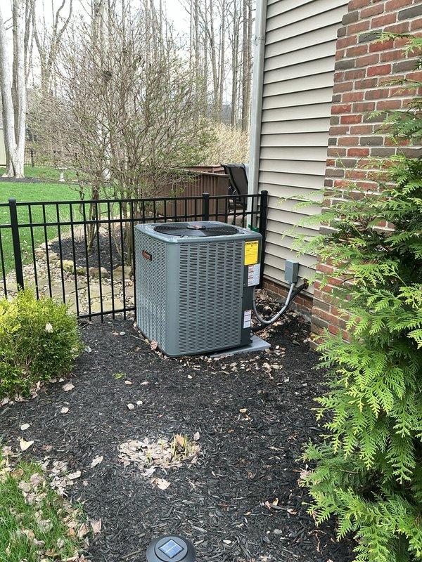Responded to warranty callback for excessive noise and vibration from recently installed air conditioning system. Inspected outdoor condenser unit and found installation on gravel pad contributing to vibration transmission through ground. Verified all mounting hardware secure and refrigerant lines properly supported. Checked indoor ductwork connections in attic space and confirmed proper attachment points and insulation placement. System operating within normal parameters with no mechanical defects identified.