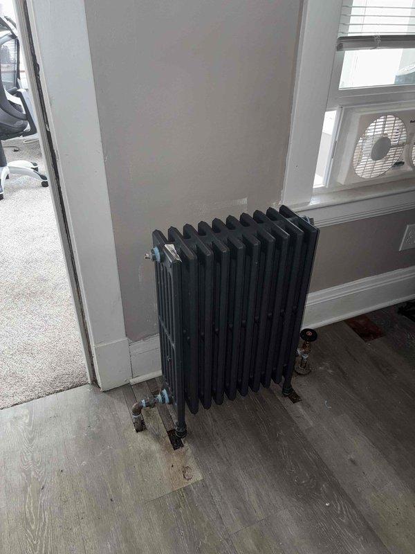 Replaced three existing column-style cast iron radiators with new thin tube radiators in attic bedroom and two second-floor bedrooms. Removed old radiator units, installed modern thin tube replacements, and connected to existing piping system. All new radiators tested for proper operation and heat distribution upon completion.