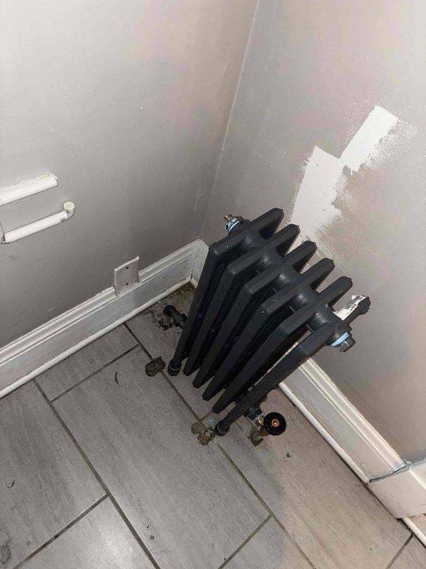 Replaced three existing column-style cast iron radiators with new thin tube radiators in attic bedroom and two second-floor bedrooms. Removed old radiator units, installed modern thin tube replacements, and connected to existing piping system. All new radiators tested for proper operation and heat distribution upon completion.
