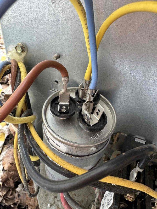 Returned to complete wiring repair on HVAC system. Reconnected and secured electrical connections at capacitor terminals and control board, ensuring all wire terminations were properly fastened and routed. Verified system operation upon completion of repair work.