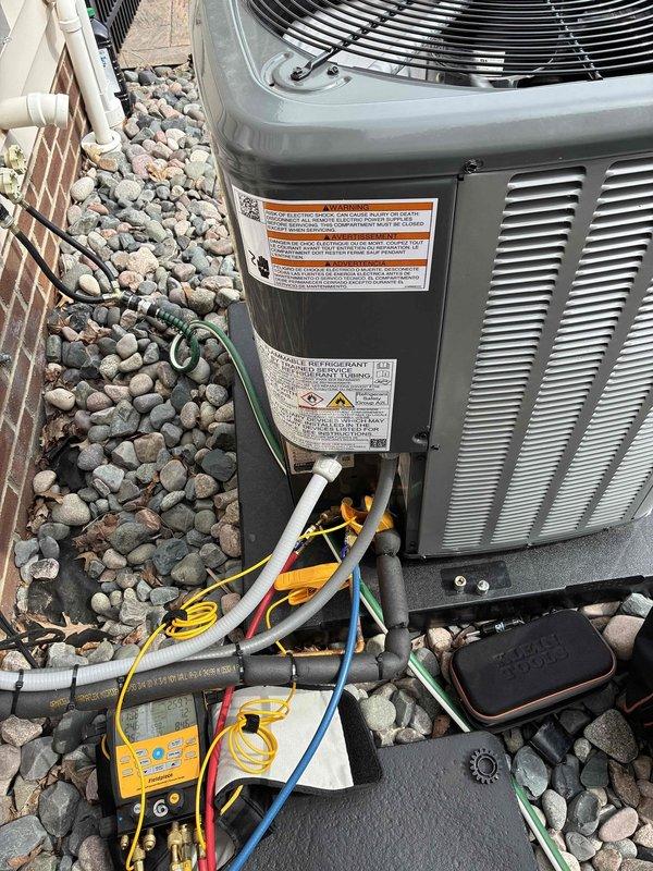 Completed comprehensive cooling maintenance on Amana outdoor condensing unit. Performed standard preventive maintenance procedures including system diagnostics with digital manifold gauges to verify refrigerant pressures and temperatures. Inspected condenser coil, fan operation, and electrical connections. All refrigerant lines and service ports were accessed for testing. Unit is operating within manufacturer specifications with proper airflow through the condenser coil and fan assembly. System tested and left in normal operating condition.