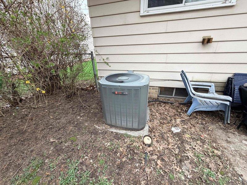 Responded to no cooling complaint on aging Trane residential air conditioning system. Upon arrival, confirmed unit was running but delivering warm air to living space. Performed diagnostic evaluation of outdoor condensing unit and determined system required further technical assessment to identify root cause of cooling failure and restore proper operation.