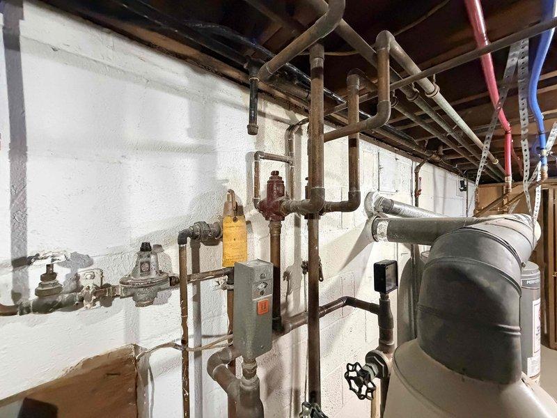 Performed comprehensive maintenance on a late 1950's single-loop hot water radiant heating boiler system. Conducted diagnostic testing using digital measurement equipment to verify system temperatures and operational parameters, inspected copper piping distribution network, pressure relief valves, zone valves, and expansion tank for proper function and signs of wear. Added boiler equipment to enhance system performance and reliability for continued operation of the vintage hydronic heating system.