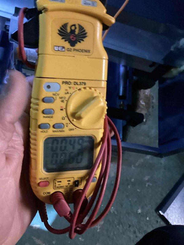Completed first-year steam boiler maintenance inspection and testing. Performed electrical diagnostics using clamp meter to verify system performance, inspected boiler grates and heat exchange surfaces for proper operation, and documented equipment condition showing normal wear patterns consistent with one year of service.